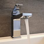 a running faucet with highly pressurized water