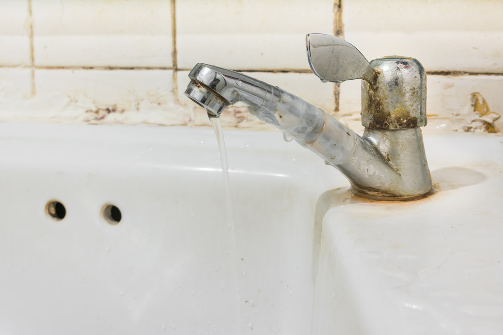 old-looking faucet or showerhead