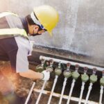plumber checking a water meter