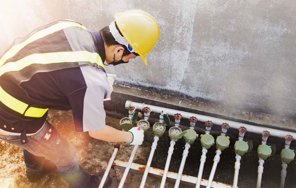 plumber checking a water meter