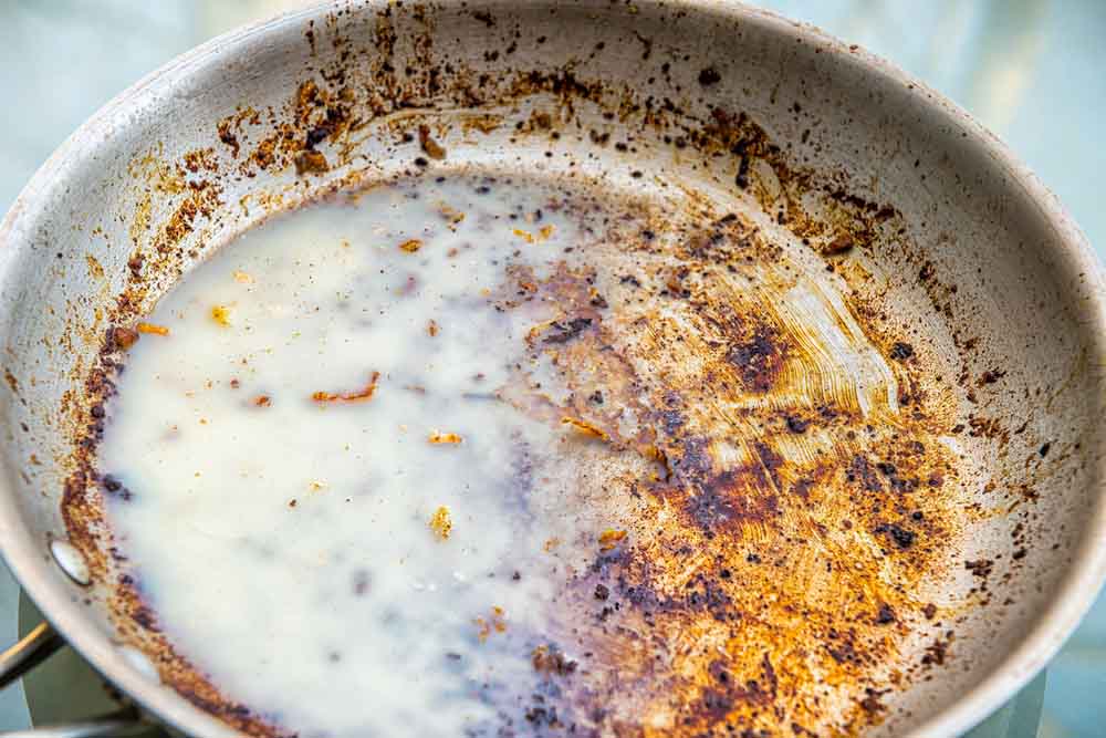 greasy pan in sink