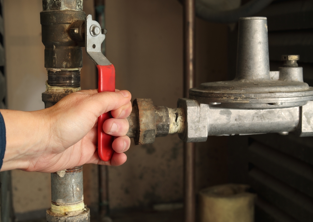 plumber shutting off water valve