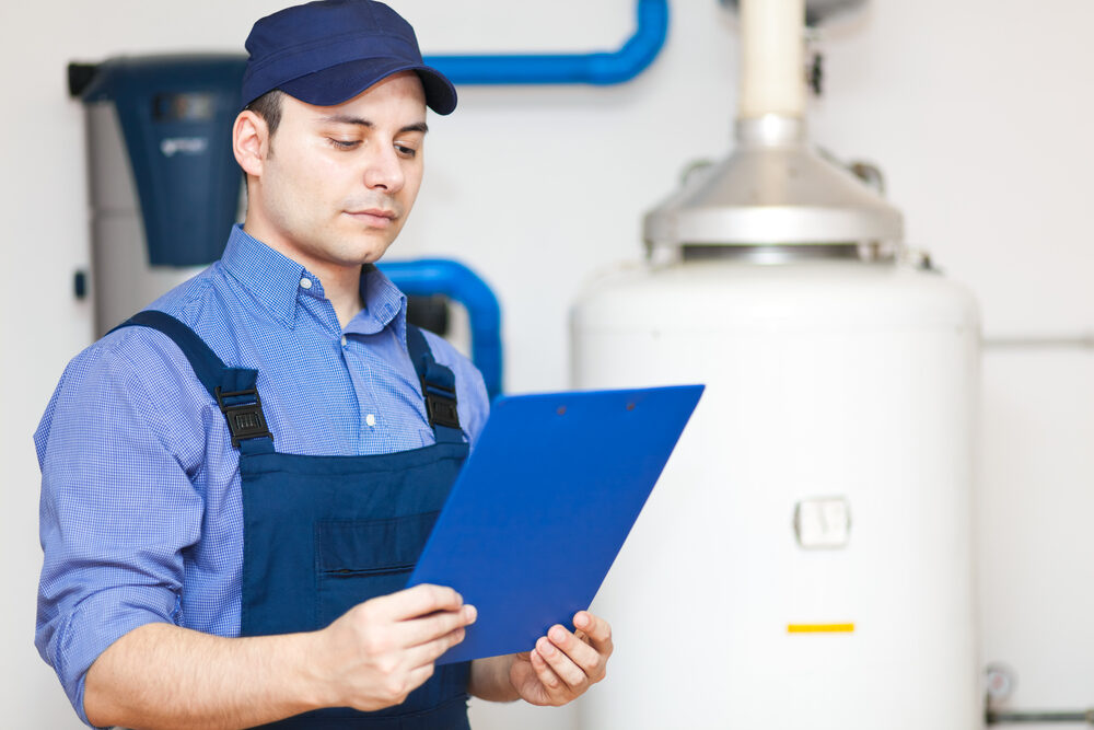 technician inspecting commercial boiler system